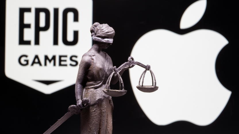 3D printed Lady Justice figure is seen in front of displayed Apple and Epic Games logos in this illustration photo taken February 17, 2021. REUTERS/Dado Ruvic/Illustration