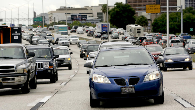 In this Tuesday, June 23, 2015 photo, rush hour traffic makes its way along Interstate 4 in Orlando, Fla. The longest average commute in Florida is found in the Cape Coral-Fort Myers metro area, Port St. Lucie and Orlando metro areas are tied for third place. (AP Photo/John Raoux)