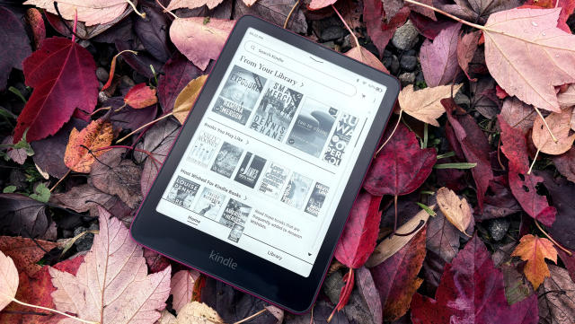 The Kindle Paperwhite Signature Edition hangs out on a bed of fallen leaves. 