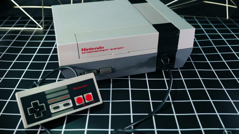 A Nintendo NES console pictured with a controller.