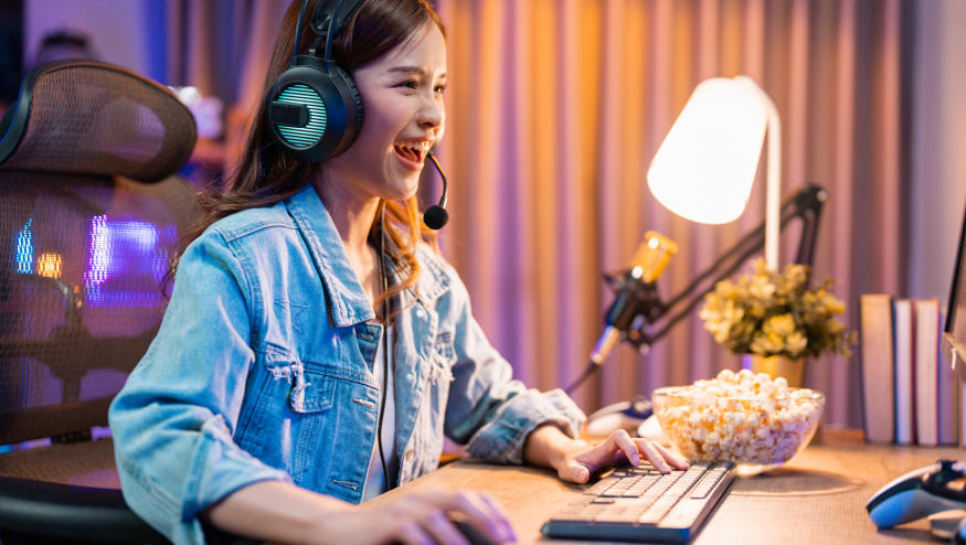 Young eSports woman player competing at an eSports event in her room