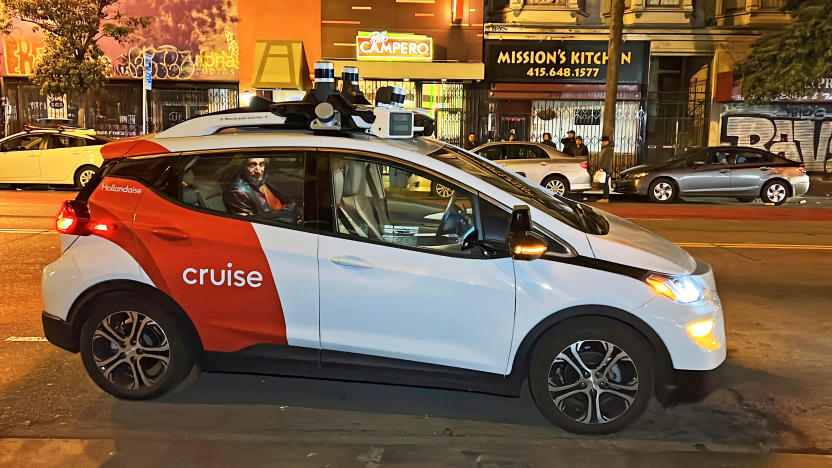 FILE - Associated Press reporter Michael Liedtke sits in the back of a Cruise driverless taxi that picked him up in San Francisco's Mission District, Feb. 15, 2023. The California regulator that approved the expansion of the Cruise robotaxi fleet owned by automaker General Motors is now threatening to fine the driverless service for covering up the severity of an accident that triggered the suspension of its California license. The potential penalty could be in the range of $1.5 million, based on documents filed Friday, Dec. 1, by the California Public Utilities Commission.