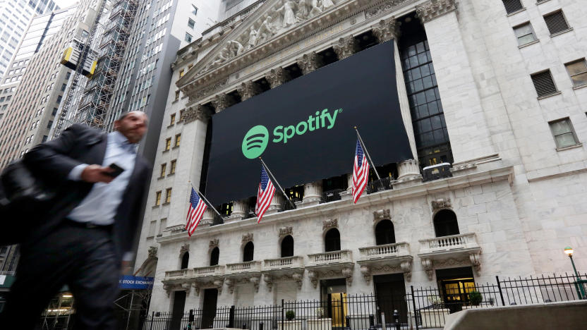 A Spotify banner adorns the facade of the New York Stock Exchange, Tuesday, April 3, 2018. Spotify, the No. 1 music streaming service which has drawn comparisons to Netflix, is about to find out how it plays on the stock market in an unusual IPO. (AP Photo/Richard Drew)