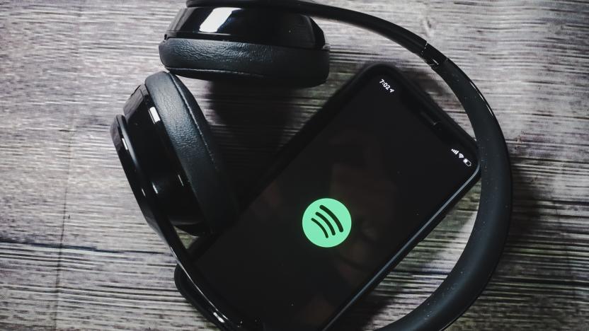 An iphone 11 screen showing spotify icon with beats earphone, perfect for listening musics on the go