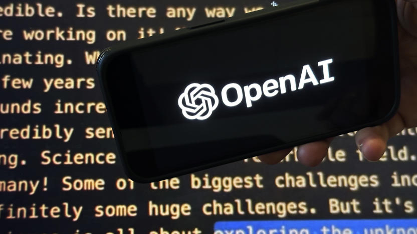 The OpenAI logo appears on a mobile phone in front of a screen showing a portion of the company website in this photo taken on Tuesday, Nov. 21, 2023 in New York. (AP Photo/Peter Morgan)