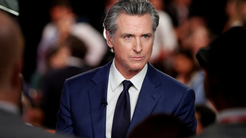 FILE PHOTO: California Governor Gavin Newsom (D) reacts as he speaks to the members of the press on the day of the first presidential debate hosted by CNN in Atlanta, Georgia, U.S., June 27, 2024. REUTERS/Marco Bello/File Photo