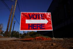 FILE PHOTO: A sign sits outside of a polling location as the battleground state opened for early voting, in Atlanta, Georgia, U.S., October 23, 2024. REUTERS/Hannah McKay/File Photo