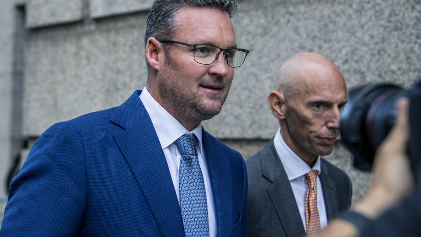 FILE - Trevor Milton, left, leaves the Thurgood Marshall United States Courthouse, Sept. 12, 2022, in New York. In a filing late Tuesday, Nov. 14, 2023, lawyers for Milton, the founder of truck maker Nikola Corp., said he should not face incarceration because his fraud conviction is nothing like the fraud that landed Theranos founder Elizabeth Holmes in prison. (AP Photo/Brittainy Newman, File)