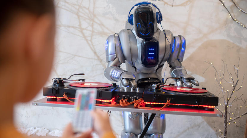 Robot dj. Girl making a selfie of her digital friend standing near dj table