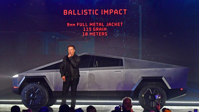 Tesla co-founder and CEO Elon Musk discusses ballistic impact in front of the newly unveiled all-electric battery-powered Tesla Cybertruck at Tesla Design Center in Hawthorne, California on November 21, 2019. 