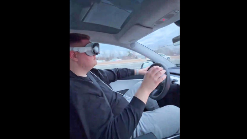 A screenshot from a video posted on X by Dante Lentini of him driving down the highway while wearing an Apple Vision Pro headset.  