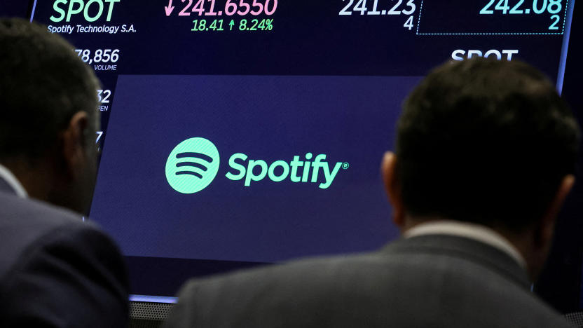 FILE PHOTO: A screen displays the logo and trading information for Spotify on the floor at the New York Stock Exchange (NYSE) in New York City, U.S., February 6, 2024.  REUTERS/Brendan McDermid/File Photo