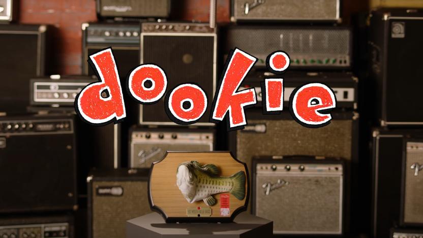 Dookie logo superimposed over amplifiers and a Big Mouth Billy Bass.