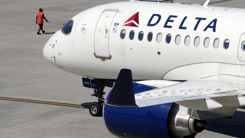 FILE - A Delta Air Lines jet leaves the gate, July 19, 2024, at Logan International Airport in Boston. Delta CEO Ed Bastian says the airline is facing $500 million in costs for the global technology breakdown that happened earlier this month. (AP Photo/Michael Dwyer, File)